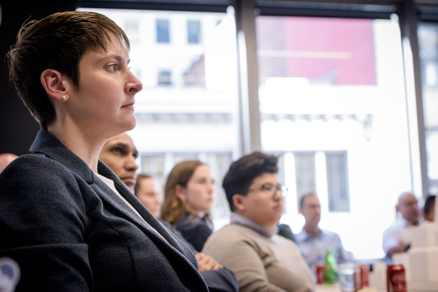 Amanda Fasenmyer sitting with fellow employees at Steinberg Hart