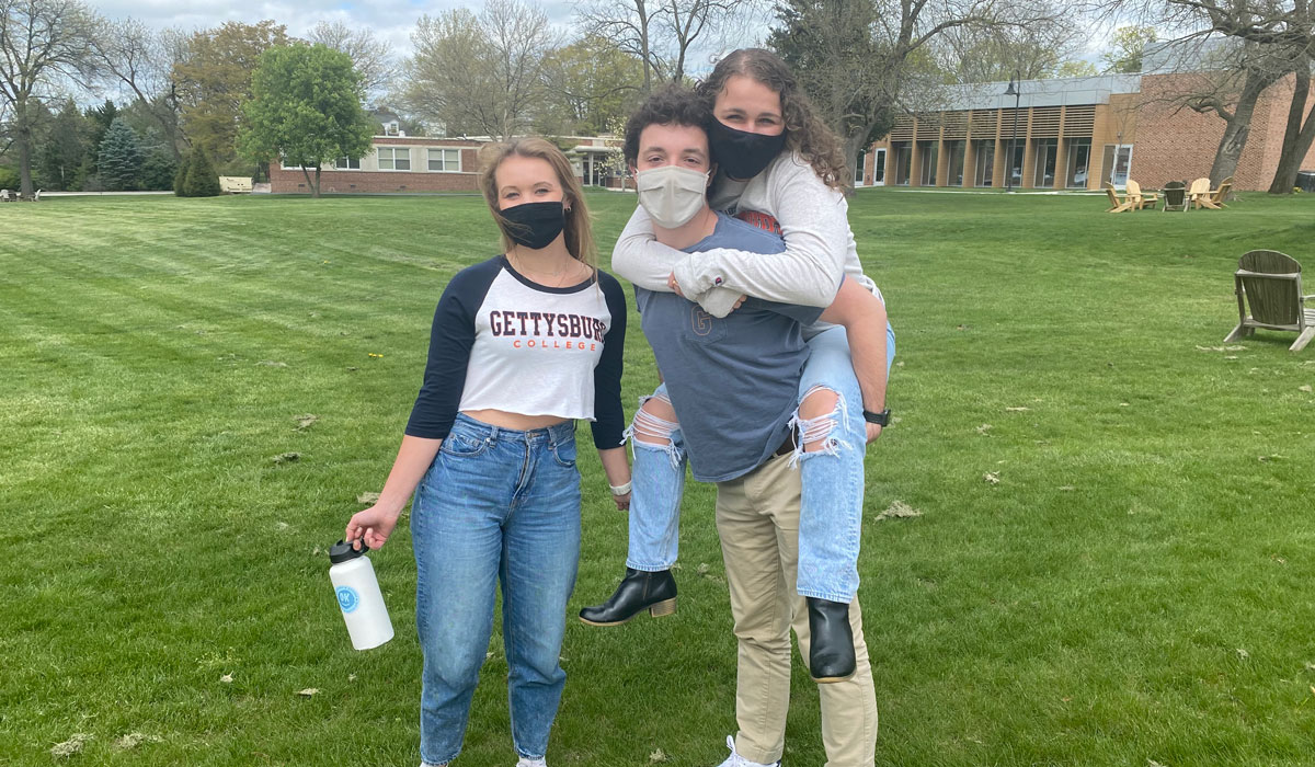 Three students wearing masks at Get Acquainted Day