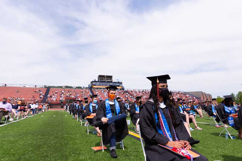 Graduates seated and spaced apart in Musselman Stadium