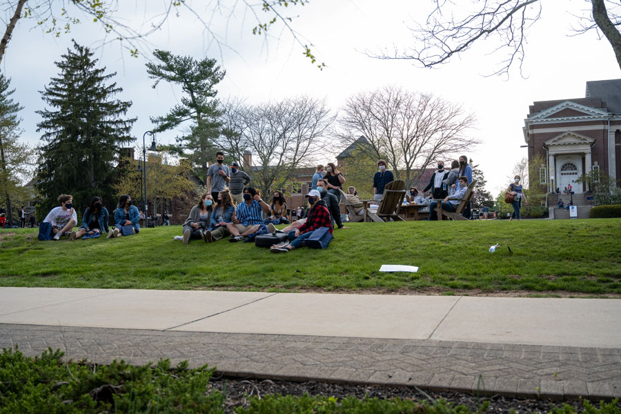 Students sitting outside on campus