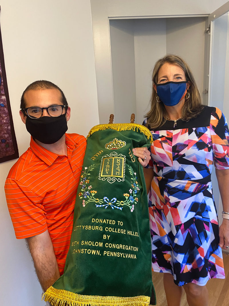 Reverend Kristin Largen with a Torah Scroll