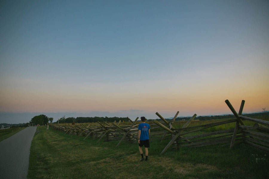 A person walking on the Gettysburg Battlefield