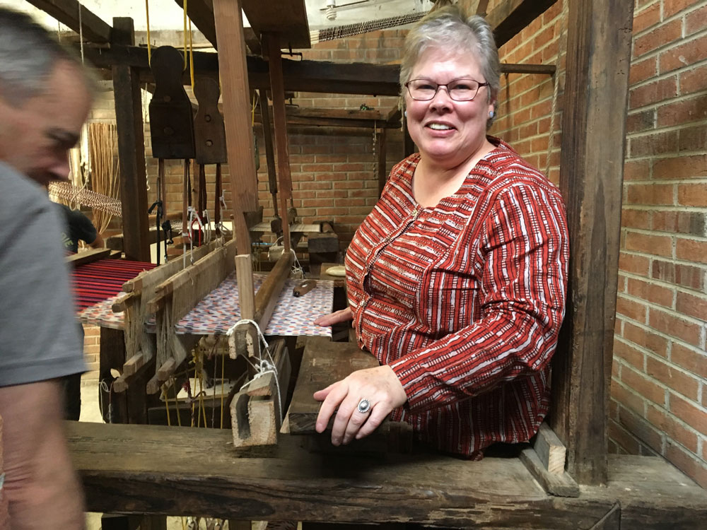 Julia Hendon weaving on an antique loom in Mexico