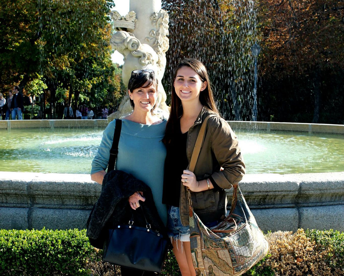 Cathie Wood and Caroline Wood standing in front of a water fountain