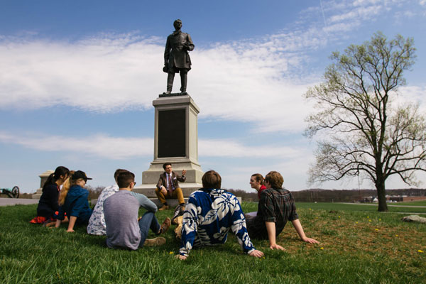 Prof. Isherwood on Gettysburg battlefield with students