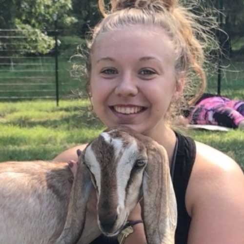 Rachel Main with a goat