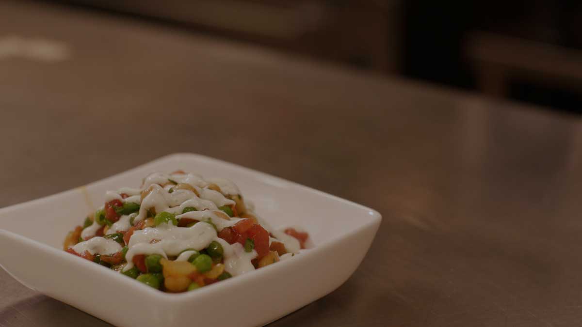 Curried chickpea bowl sitting on a counter