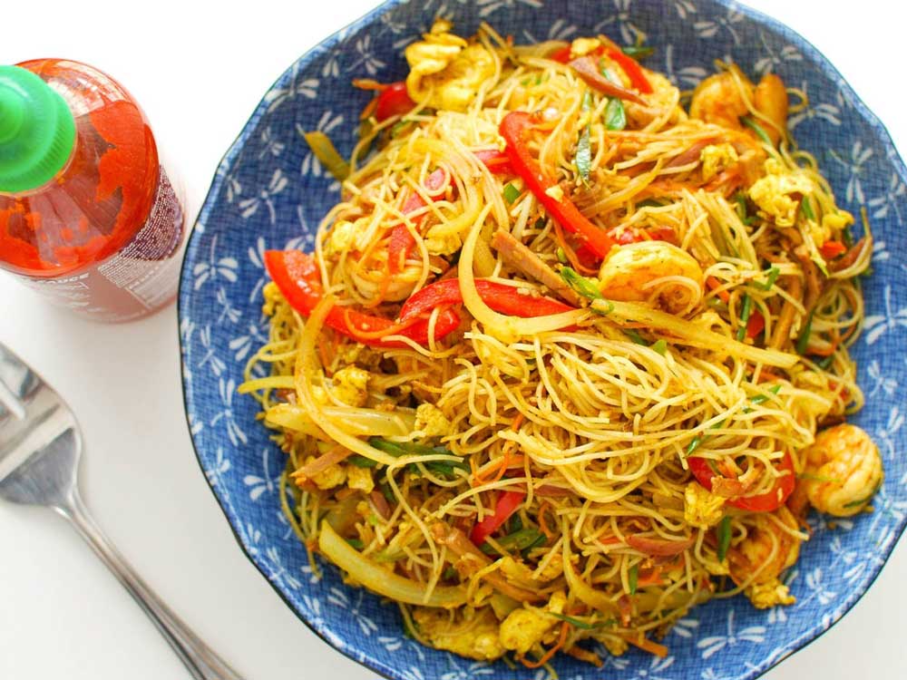 Top view of singapore noodle bowl with shrimp