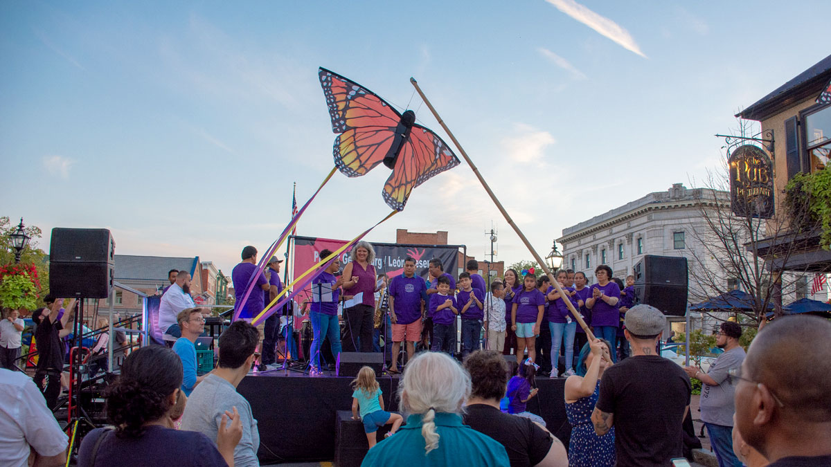 butterfly kite flying over stage at Salsa in the Square event