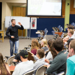 Person presenting to audience