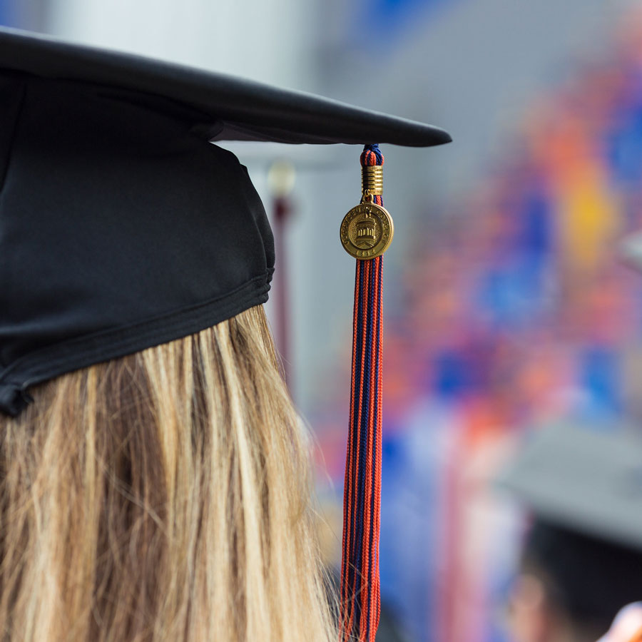 Graduate with a cap and tassle at a Commencement ceremony