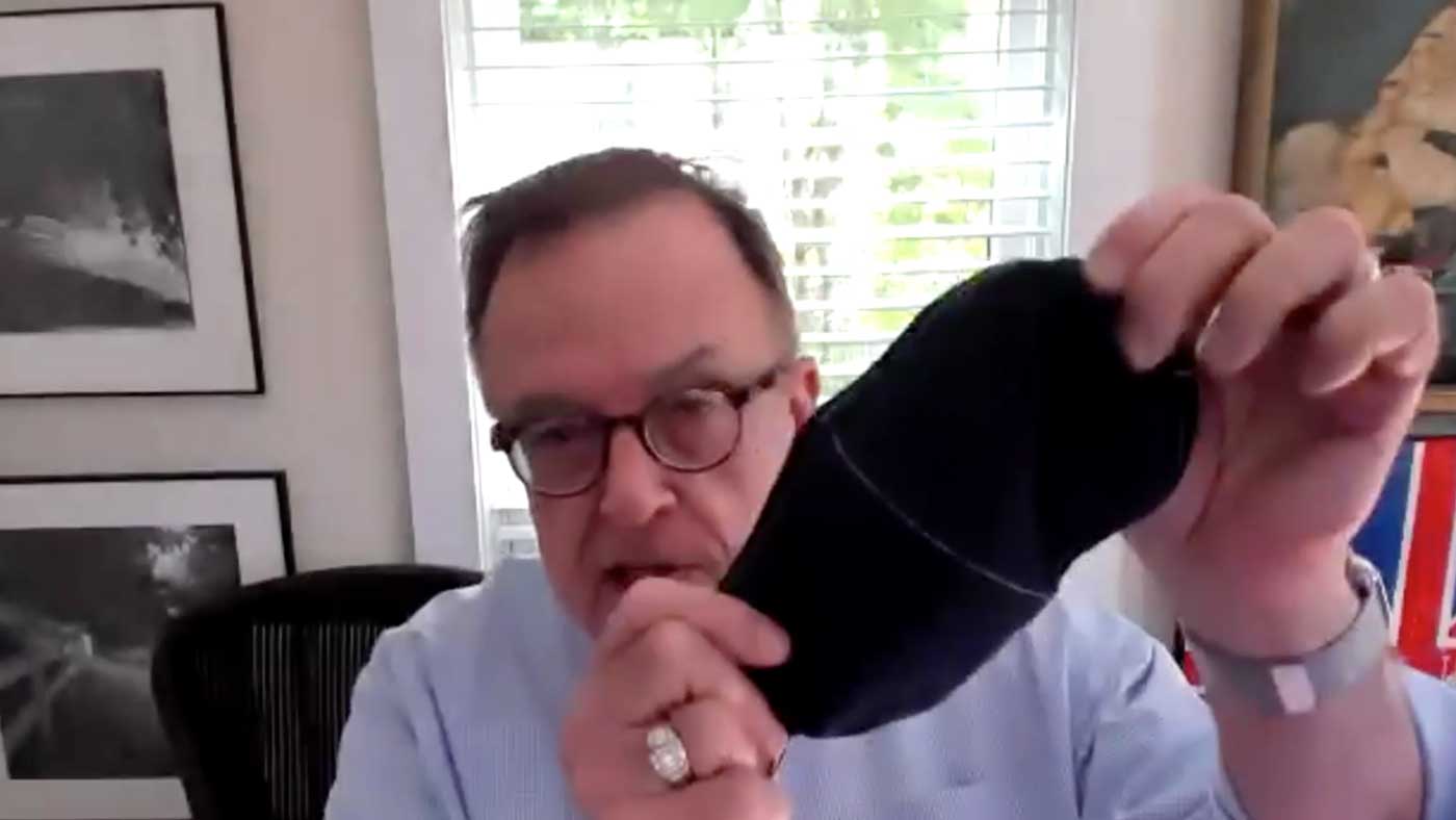 Dr. Richard Keeling demonstrates an appropriate face mask