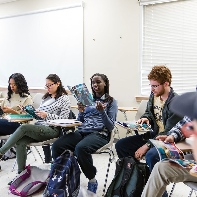 First year students reading a comic book in a First Year Seminar