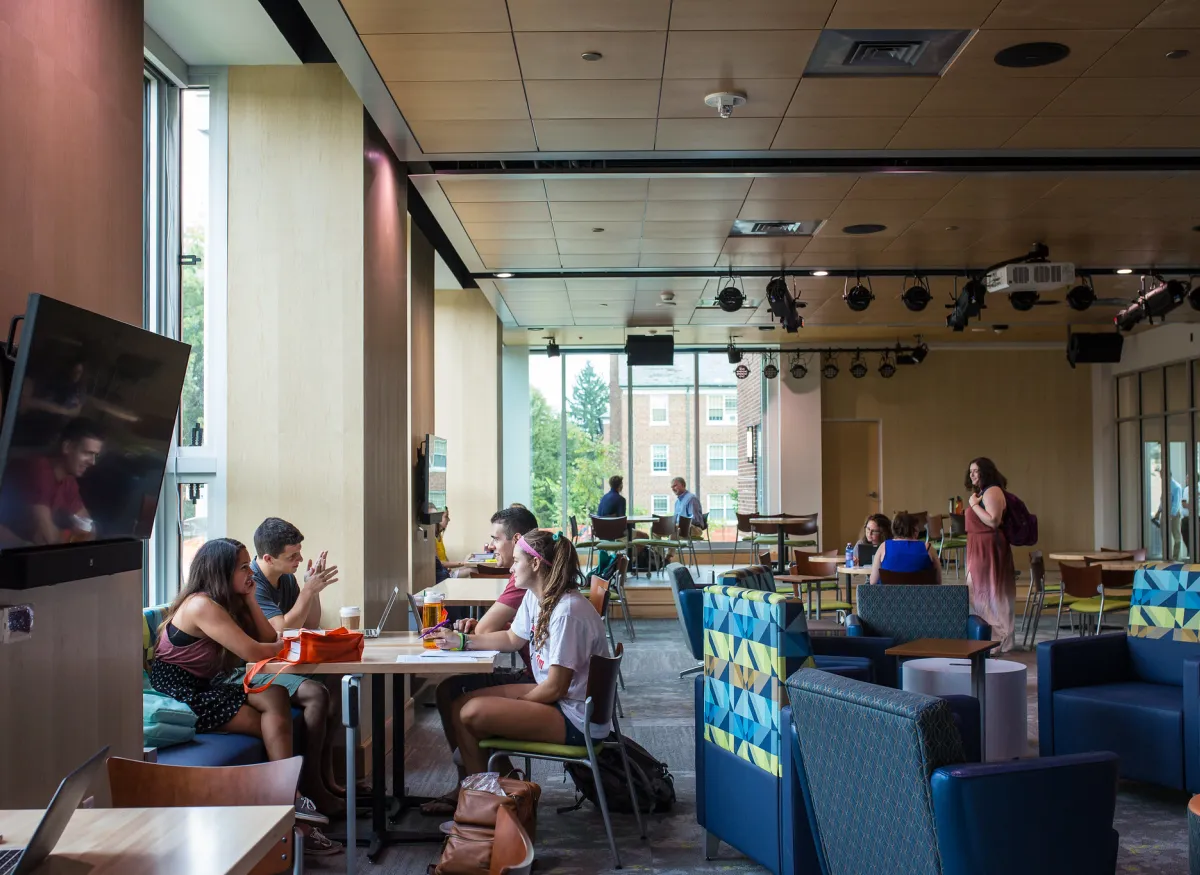 Students sitting in the Junction right outside of the Commons Marketplace