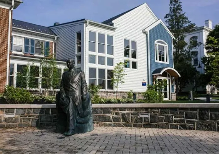 Gettysburg College campus building with a statue in front