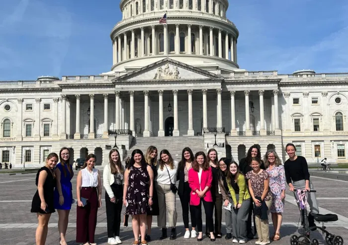 Group of students posing in front of the U.S. Capitol.