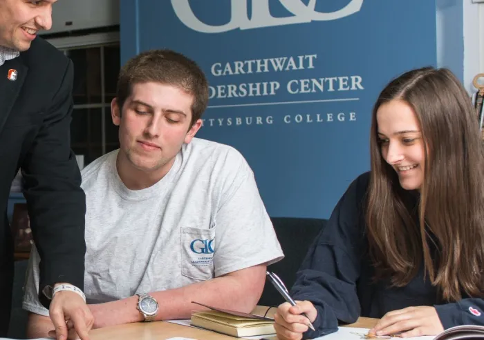 Students work together at a table in the Garthwait Leadership Center.