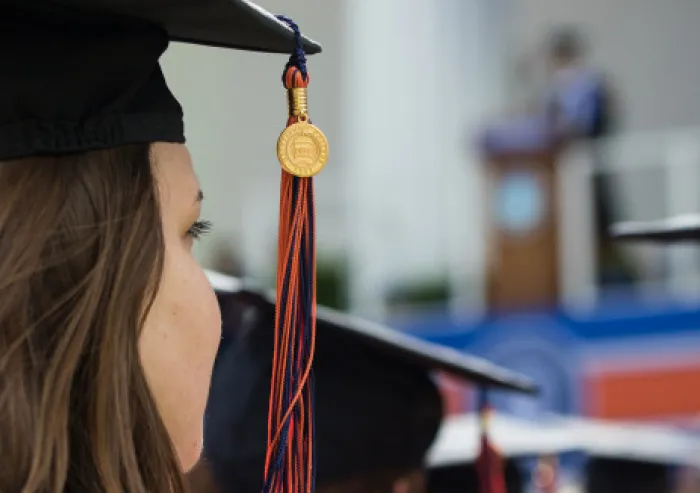 Graduate wearing a cap and tassel during a commencement ceremony