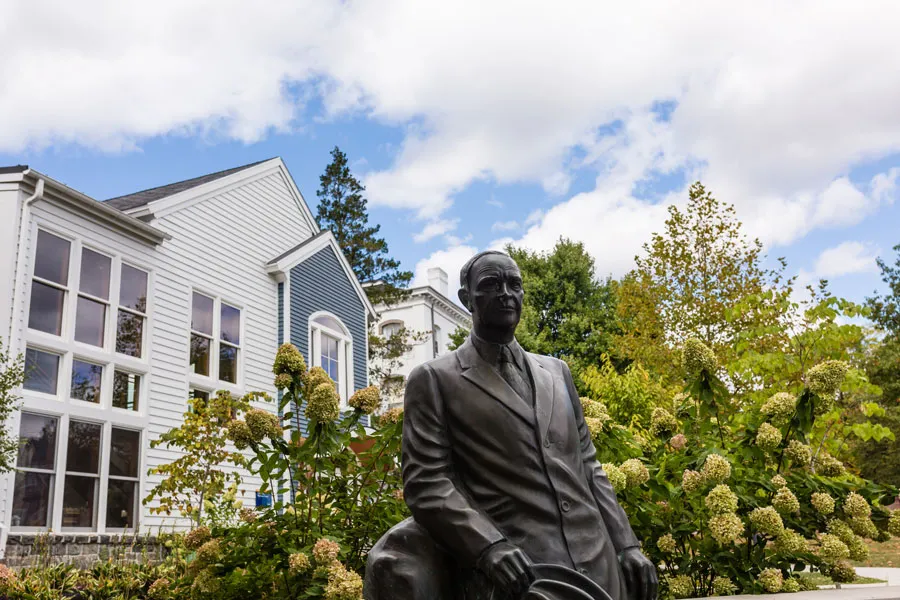 Dwight Eisenhower statue in front of College buildings