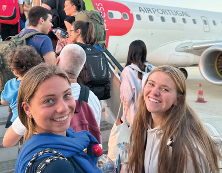 A photo of students boarding a plane