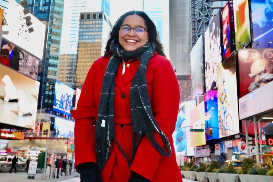 Solangel Hernández López ’26 in Times Square on the Wall Street Trek.