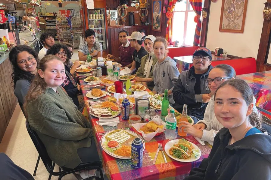 First-Year Seminar students share a meal on a 2024 field trip.