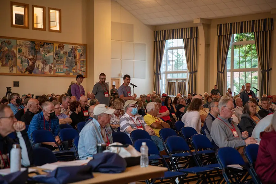 Audience members listening to a speech during the annual CWI Summer Conference