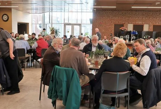 Patrons eat at the Atrium in the campus dining hall.