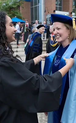 A student receives the stole of gratitude