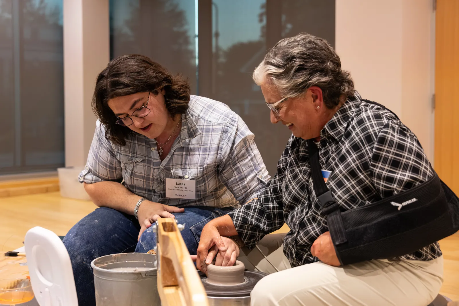 Lucas Pacuraru ’27 and Art & Art History Prof. Tina Gebhart demonstrate their unique collaboration in making pottery. 