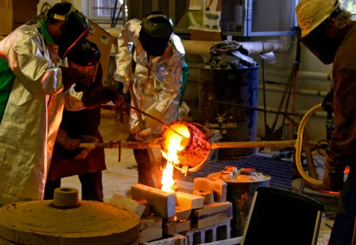 student work with molten material