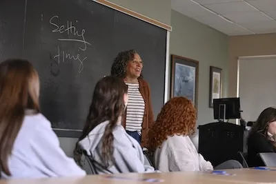 A professor instructs her class.
