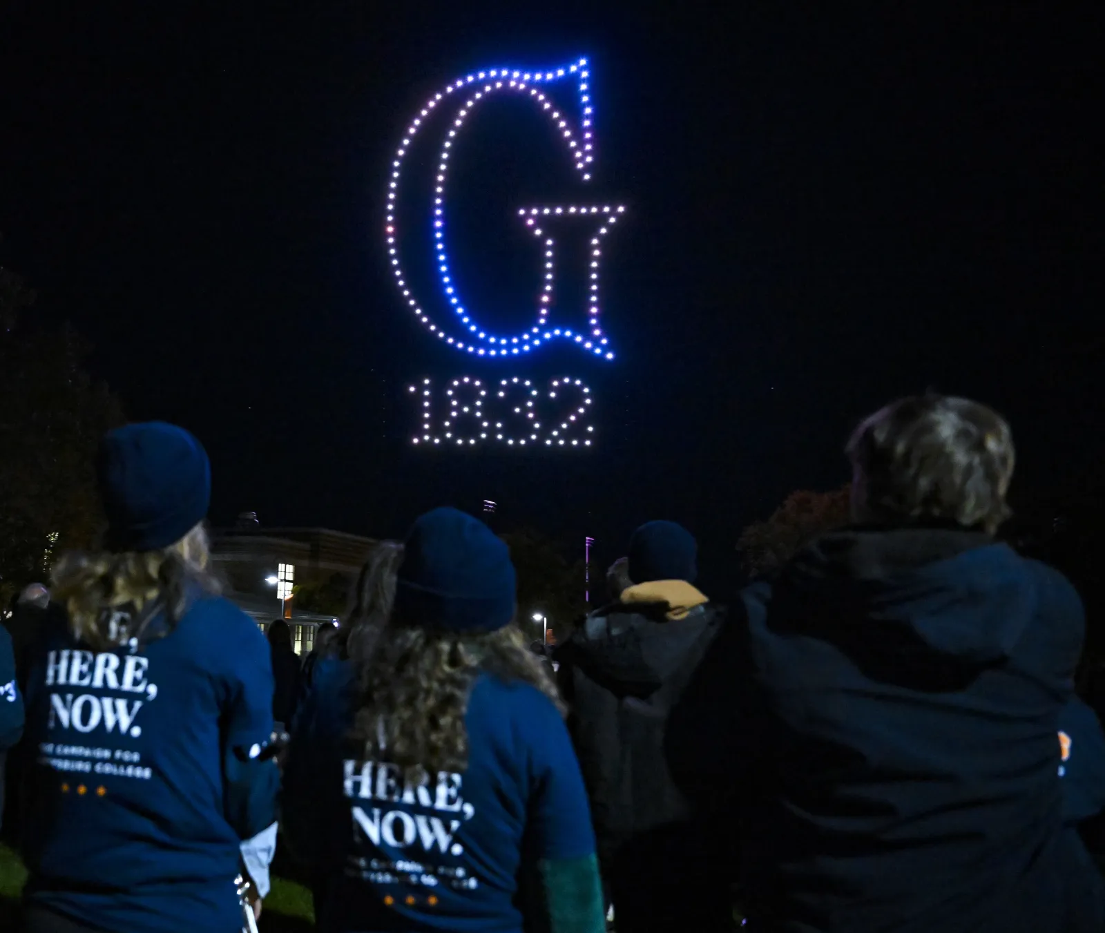 Students, staff, faculty, alumni, and friends came together as a community to watch a drone show on the north side of campus (Photo by Jason Minick). 