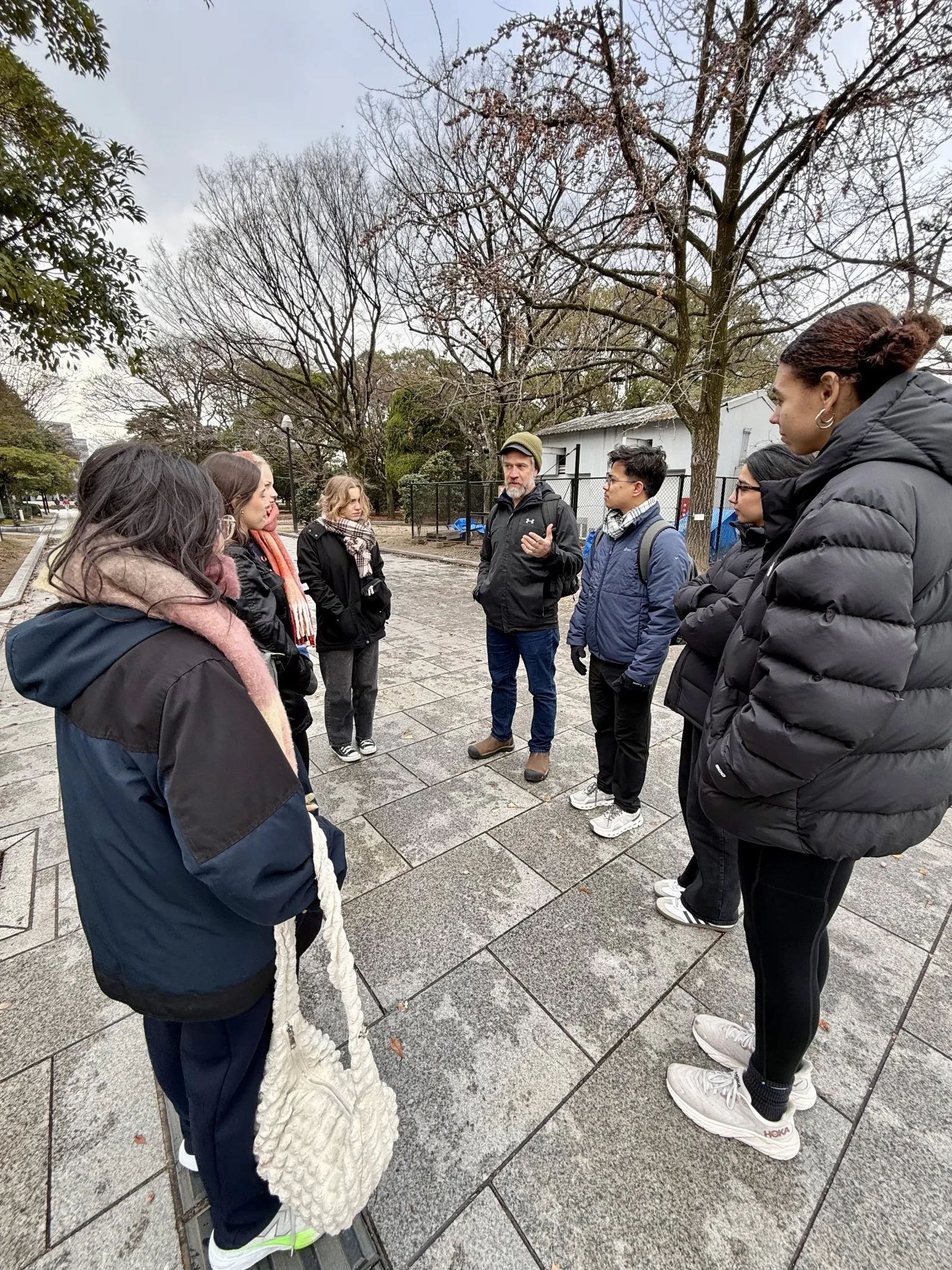 Fellows gather outside to speak