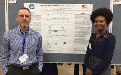 Psychology Prof. Brian Meier with Oluwatobi (Justina)  Molokwu '17 presents research on the effect of mindful chocolate consumption on mood at an NCA conference in 2017.
