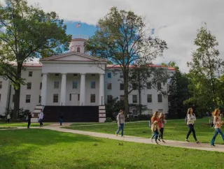 Students walk down a path in front of Pennsylvania Hall on the Gettysburg College campus.