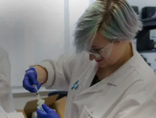 Three scientists working in the lab