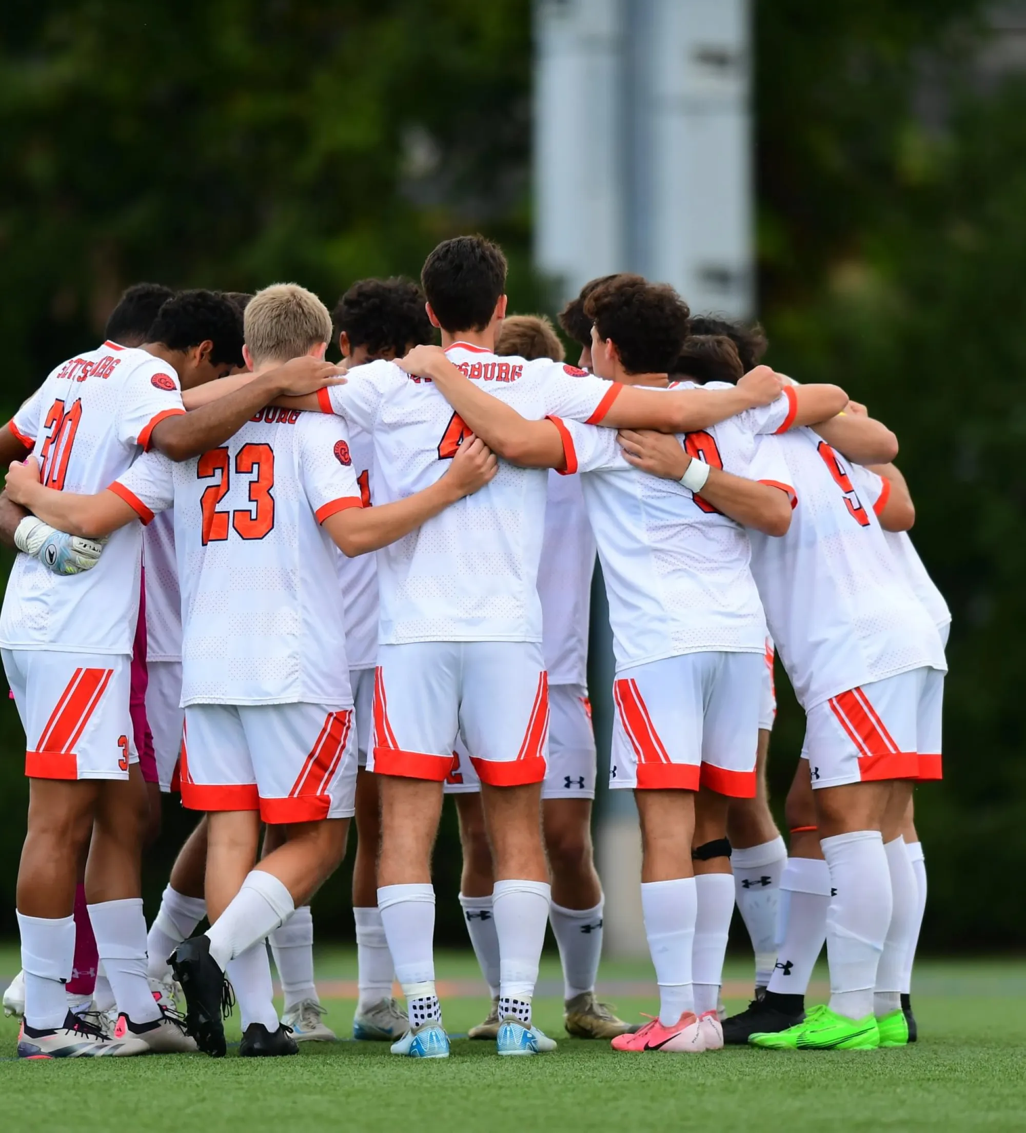 Team in huddle on field