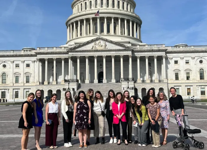 Group of students posing in front of the U.S. Capitol.
