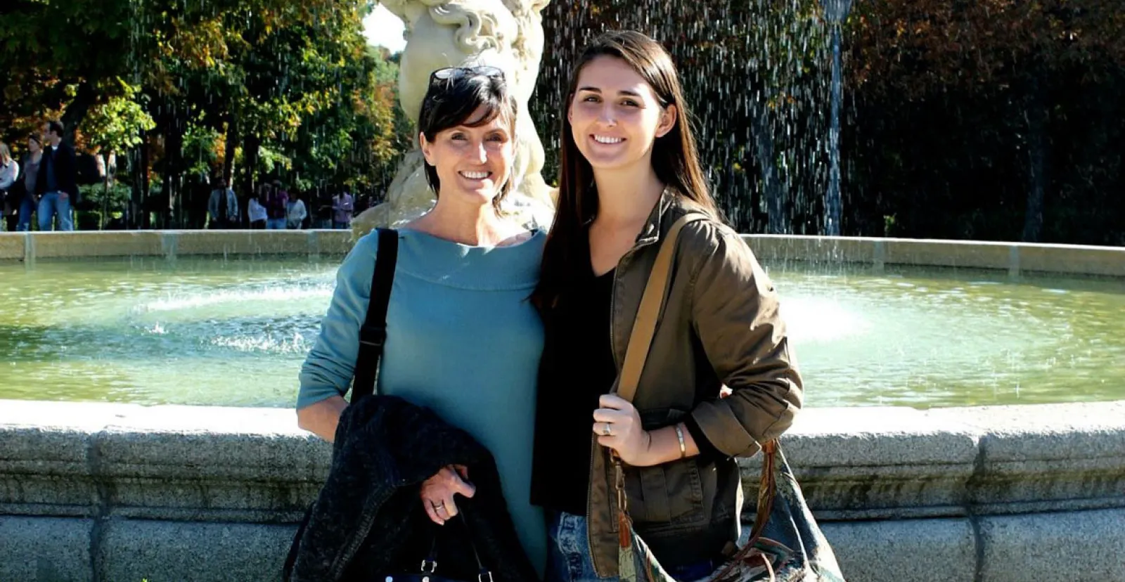 Cathie Wood and Caroline Wood standing in front of a water fountain