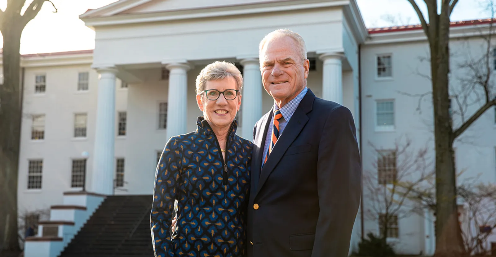 Joan ’76 and Rick Schweizer ’76 in front of Penn Hall