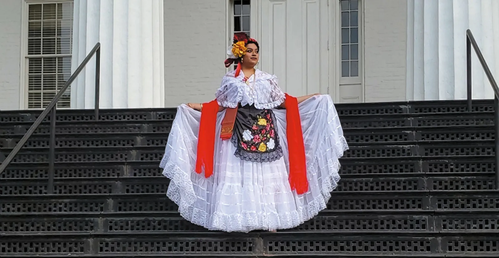 Ivana Lopez Espinosa ’19 stands on the steps of Penn Hall