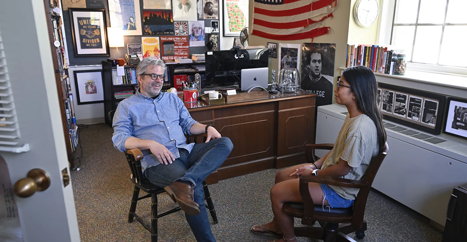 Dave Powell speaking to a student