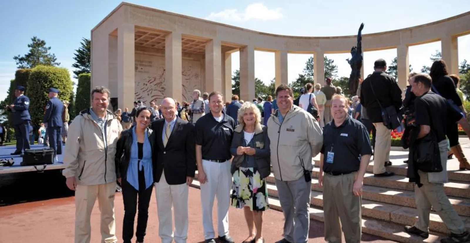 group of people smile at military event