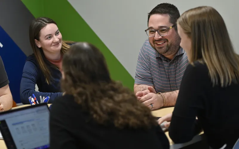 A group of people having a conversation
