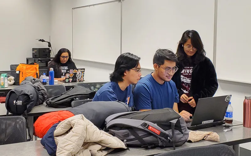 Thuc Duy Tran ’27, Sanij Shrestha ’26, and Yashaswe Amatya ’26, along with Thuc Duy Tran ’27 work on a project