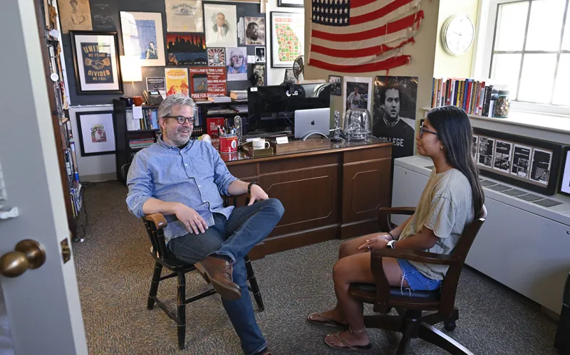 Dave Powell speaking to a student