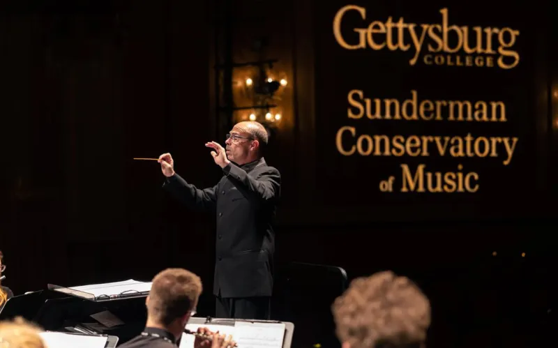 Russell McCutcheon conducting the Wind Symphony 