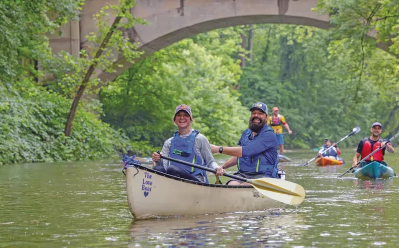  Nathan Reigner ’01 and Corey Breneisen paddle the Schuylkill River during the Schuylkill River Greenway’s annual sojourn.