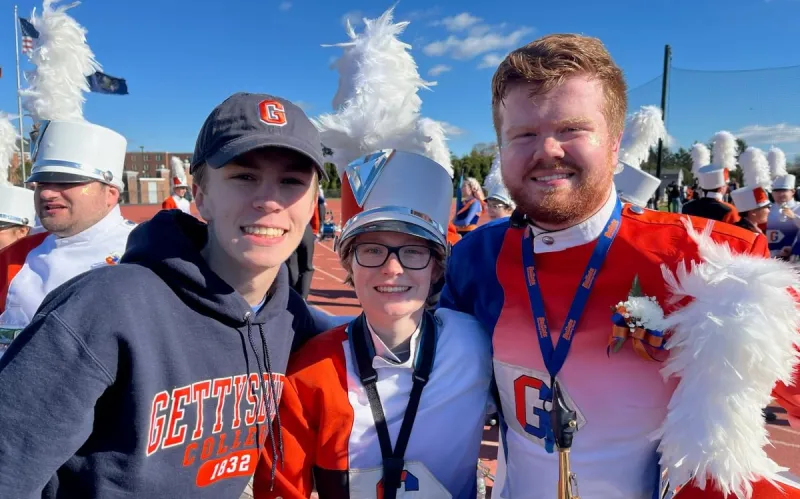 Michael ’25 and Mary ’28 Tropp with their younger sibling, Andrew